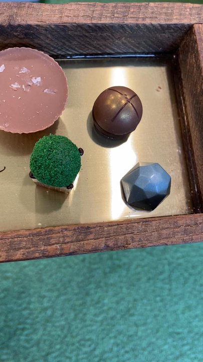 Chocolat By Adam Turoni - You get a tray and pair of tongs and pick out your chocolates. When you are done, they will bag or box them at the counter. - Chocolatiers & Shops Near Me - Savannah, Georgia