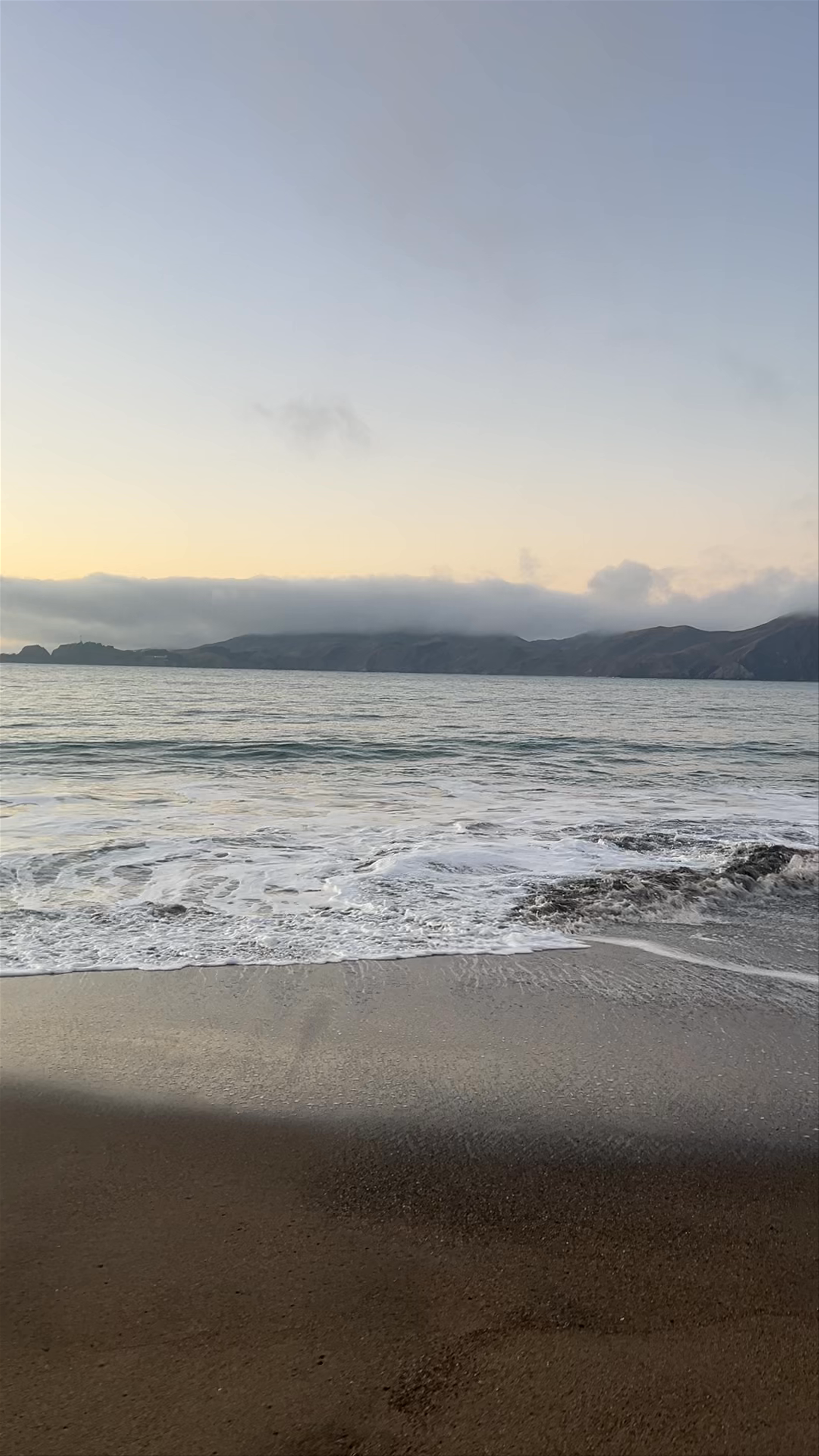 Baker Beach Views: Tranquil Sunrise Over Golden Gate Bridge