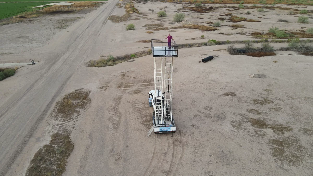 Aerial drone flyover of the raised Sky High Trailer in the desert