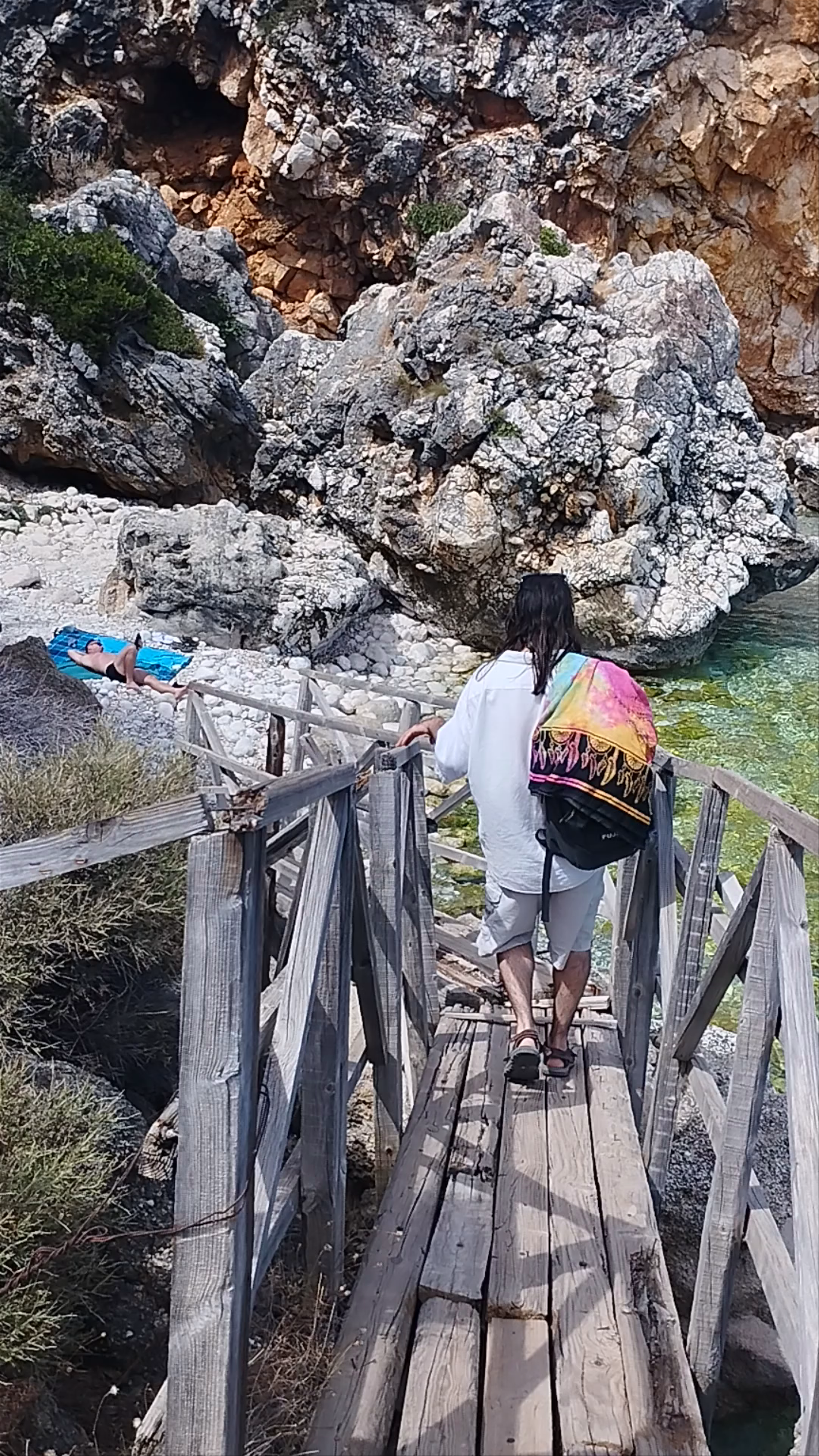 Pelagos Beach Escape: Crystal Waters and Rocky Serenity in Skala, Greece