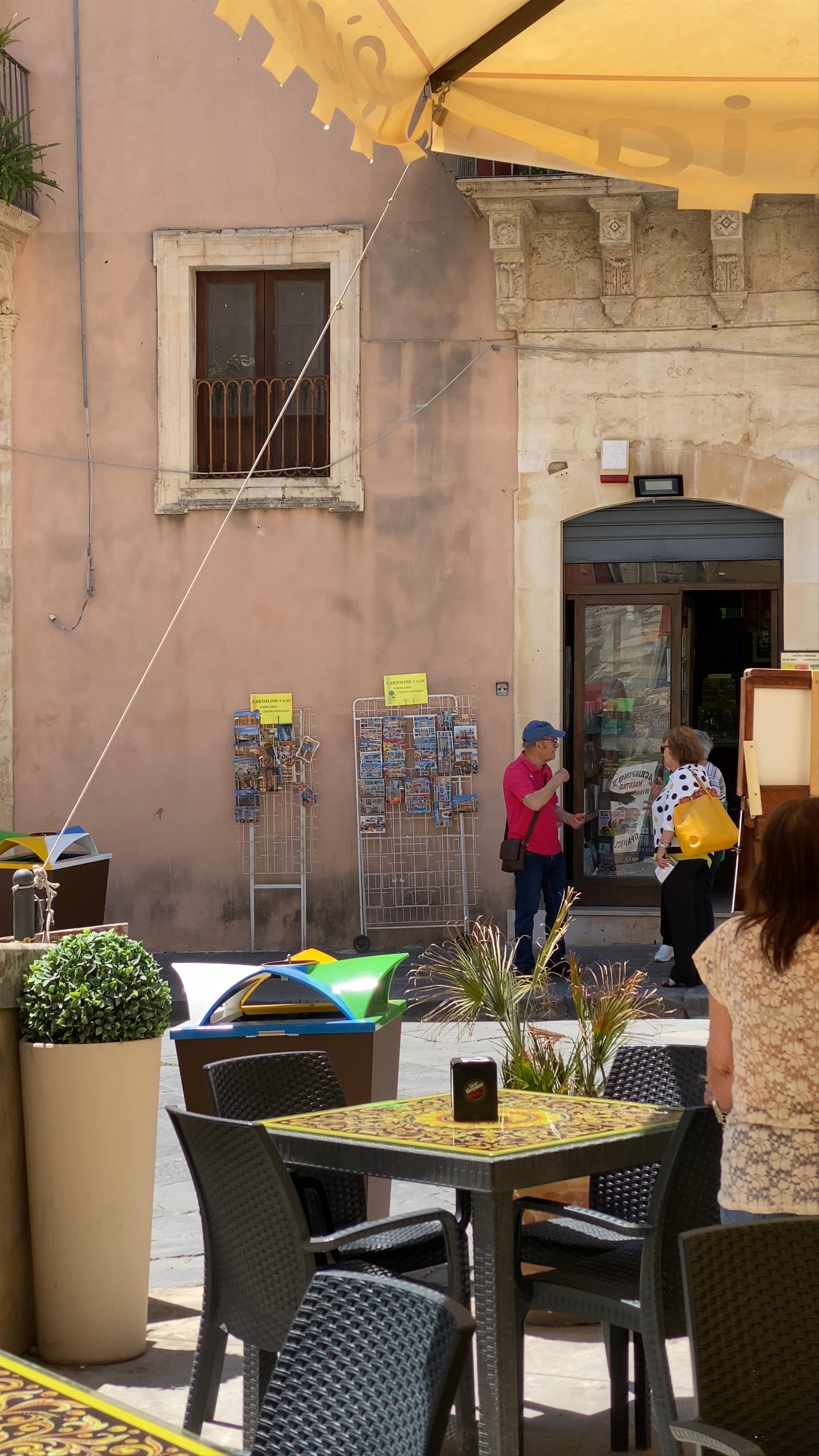 Charming Outdoor Dining and Street Life at Ristorante Pizzeria Bar La Vecchia Fontana in Noto, Sicily