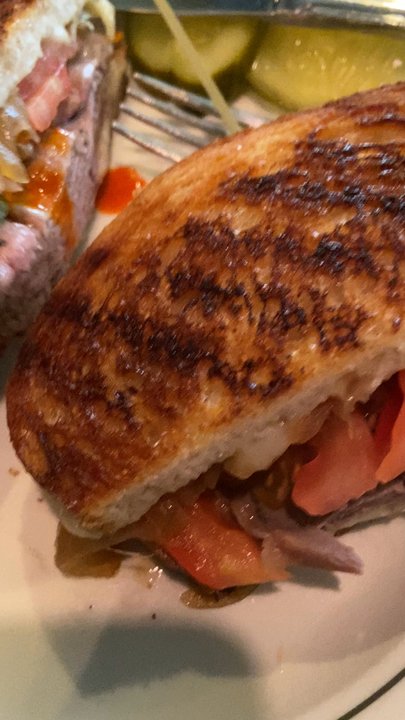 Blind Tiger Ale House - Grilled roast beef sandwich w/ provolone, onions and slice tomato's on toasted bread - American Near Me - New York, New York
