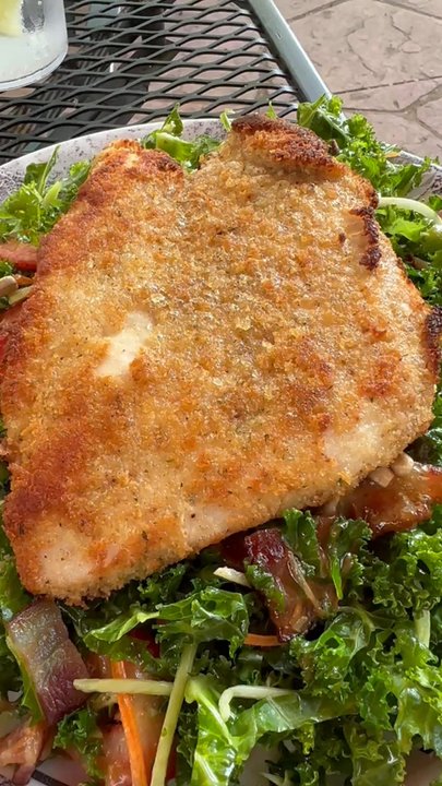 Cimmini's - Chicken parmesan bubbling, over kale salad - Italian Near Me - Niwot, Colorado