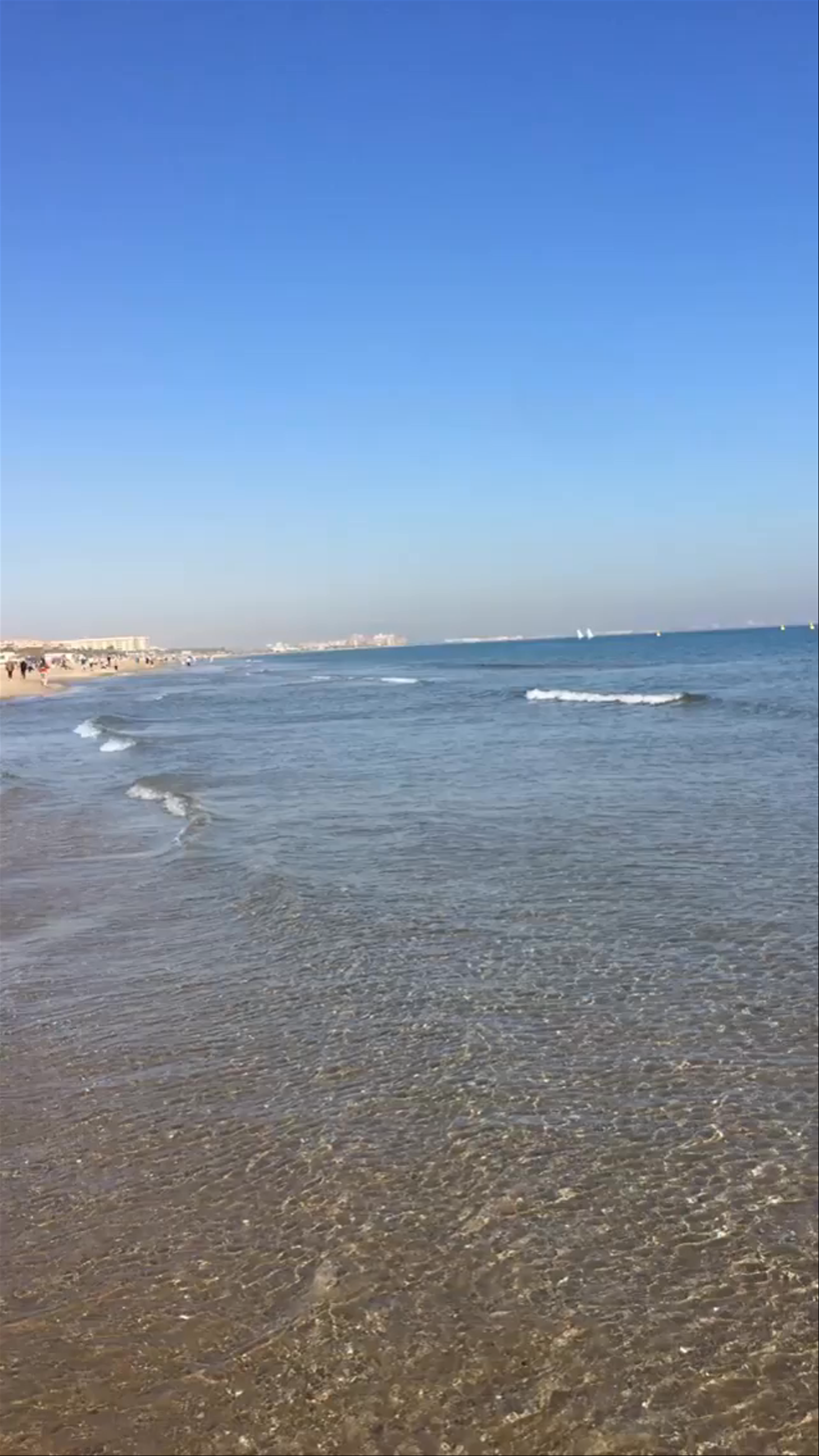 Serene Waves and Sunny Skies at Playa Malvarrosa, Valencia