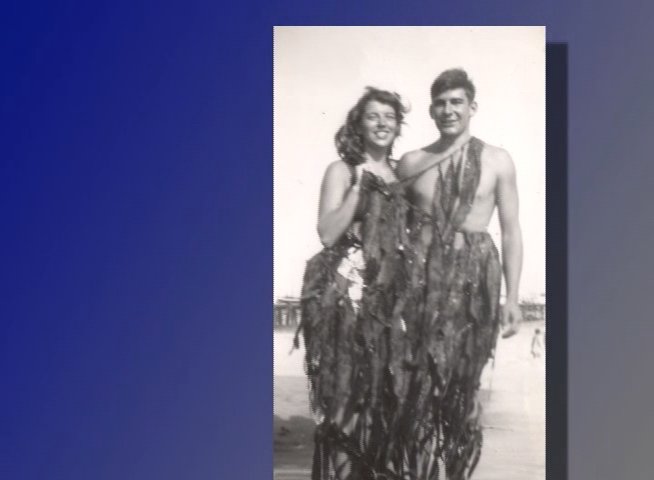An elderly man shares personal reflections while vintage black-and-white photographs of his past, including his wedding and beach outings, are displayed alongside him.
