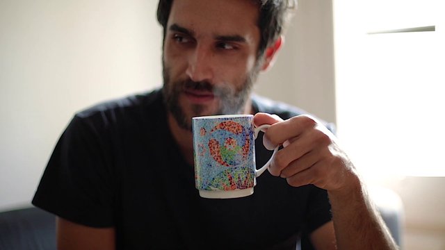 Man drinking a cup of tea
