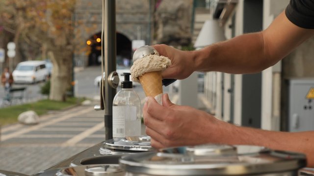 Man buying ice cream for his girlfriend