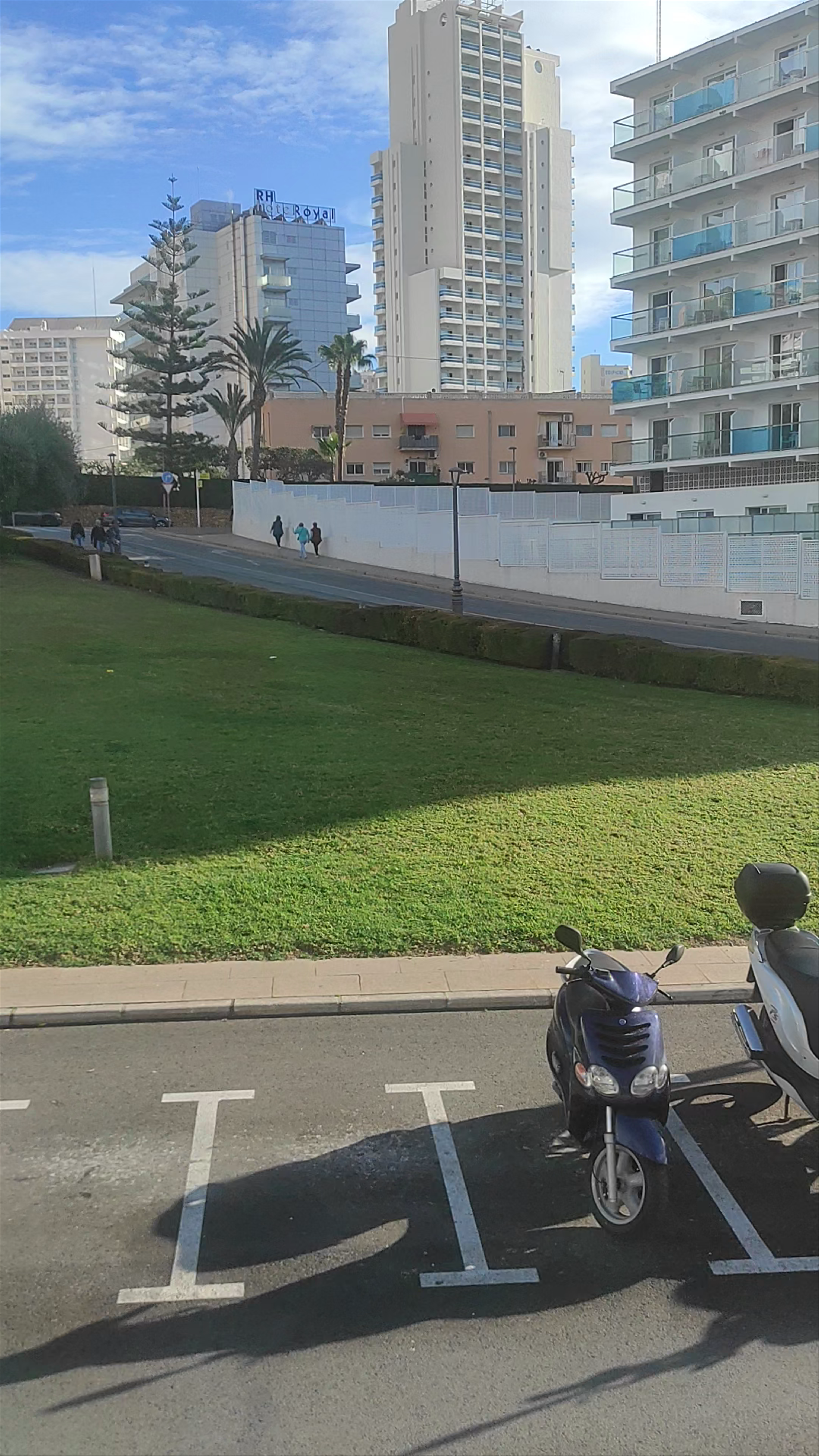 Sunny Urban Walk Through Benidorm Cityscape