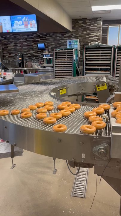 Krispy Kreme - Such a cool donut machine! Fun to watch while sipping your coffee - Donuts Near Me - Rancho Mirage, California