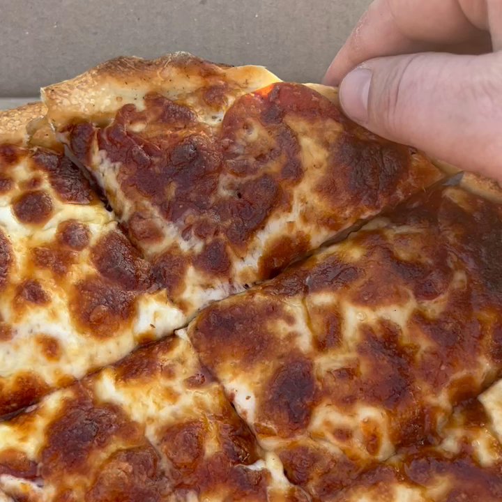 Wilson Pizza Palace - Grabbing  a triangular pepperoni slice from a medium pie - Pizza Near Me - Windsor, Connecticut