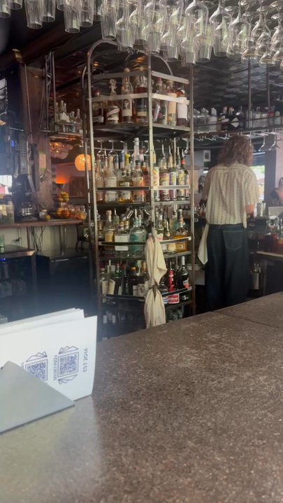 The Mode Lounge - All the liquor on the cool little spinny spin rack - Lounges Near Me - Boise, Idaho