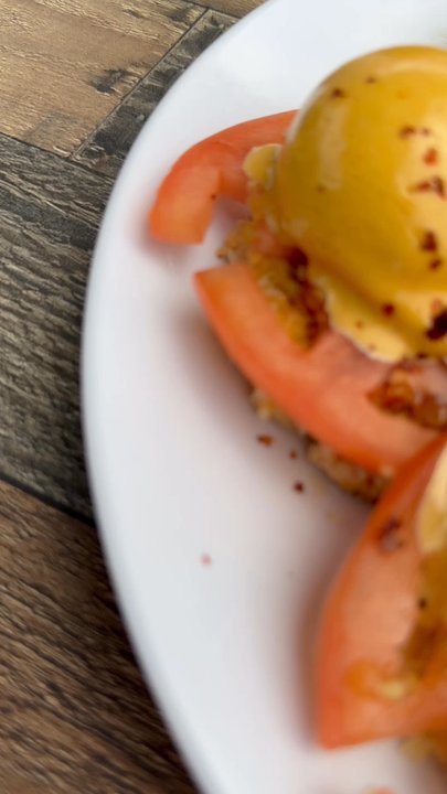 Frying Pan NYC - Eggs Benedict with tomato and pork belly. That pork belly was soo soo good!! - Bars Near Me - New York, New York