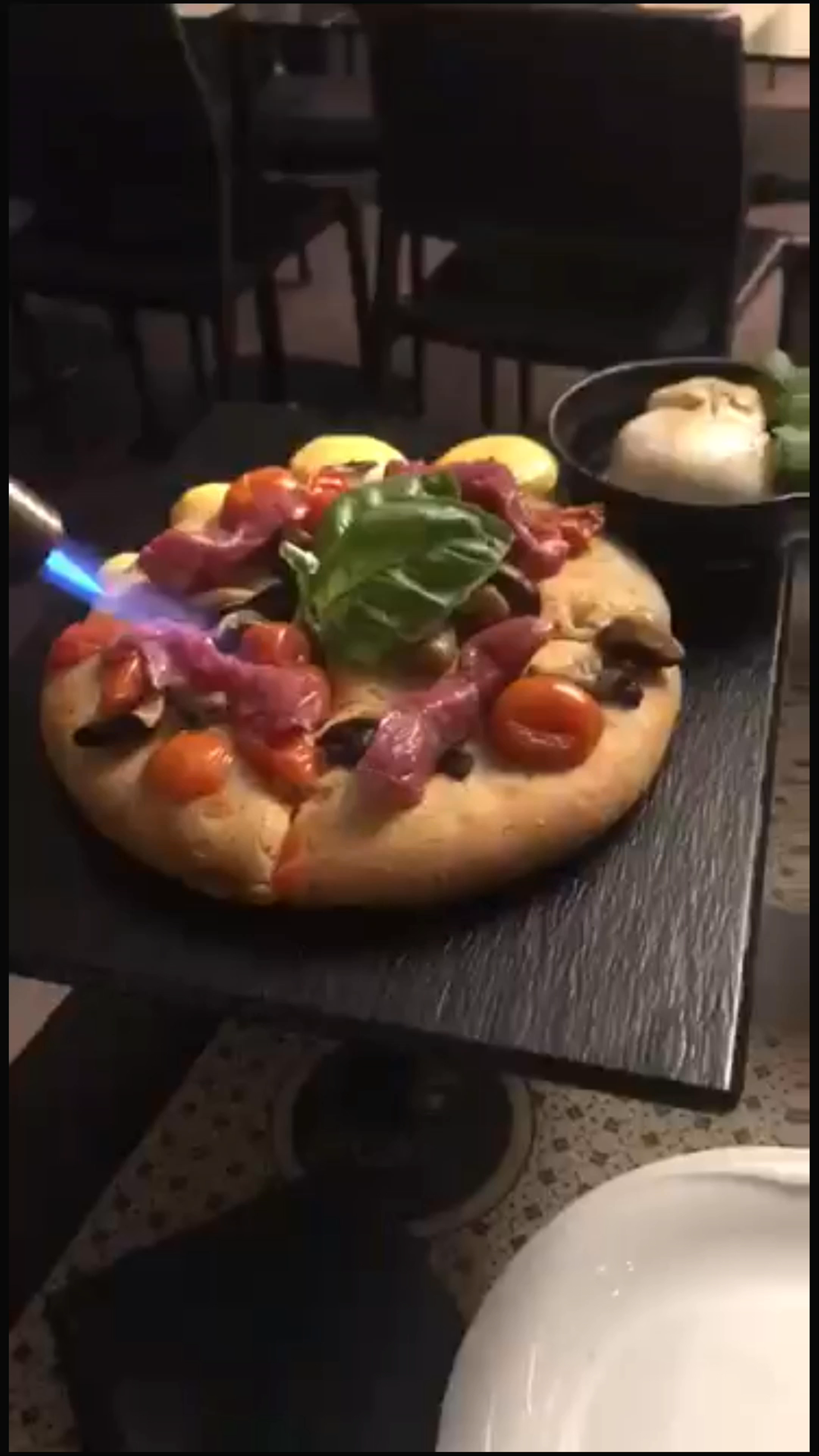 Fiery Italian Delight: Artisan Pizza Torch-Finished in Bari