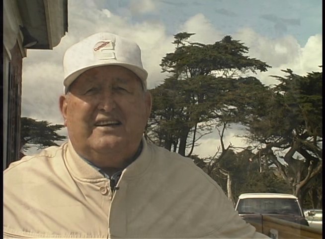 Historical footage documents a community beach cleanup effort, accompanied by firsthand accounts from individuals reflecting on the environmental restoration process.