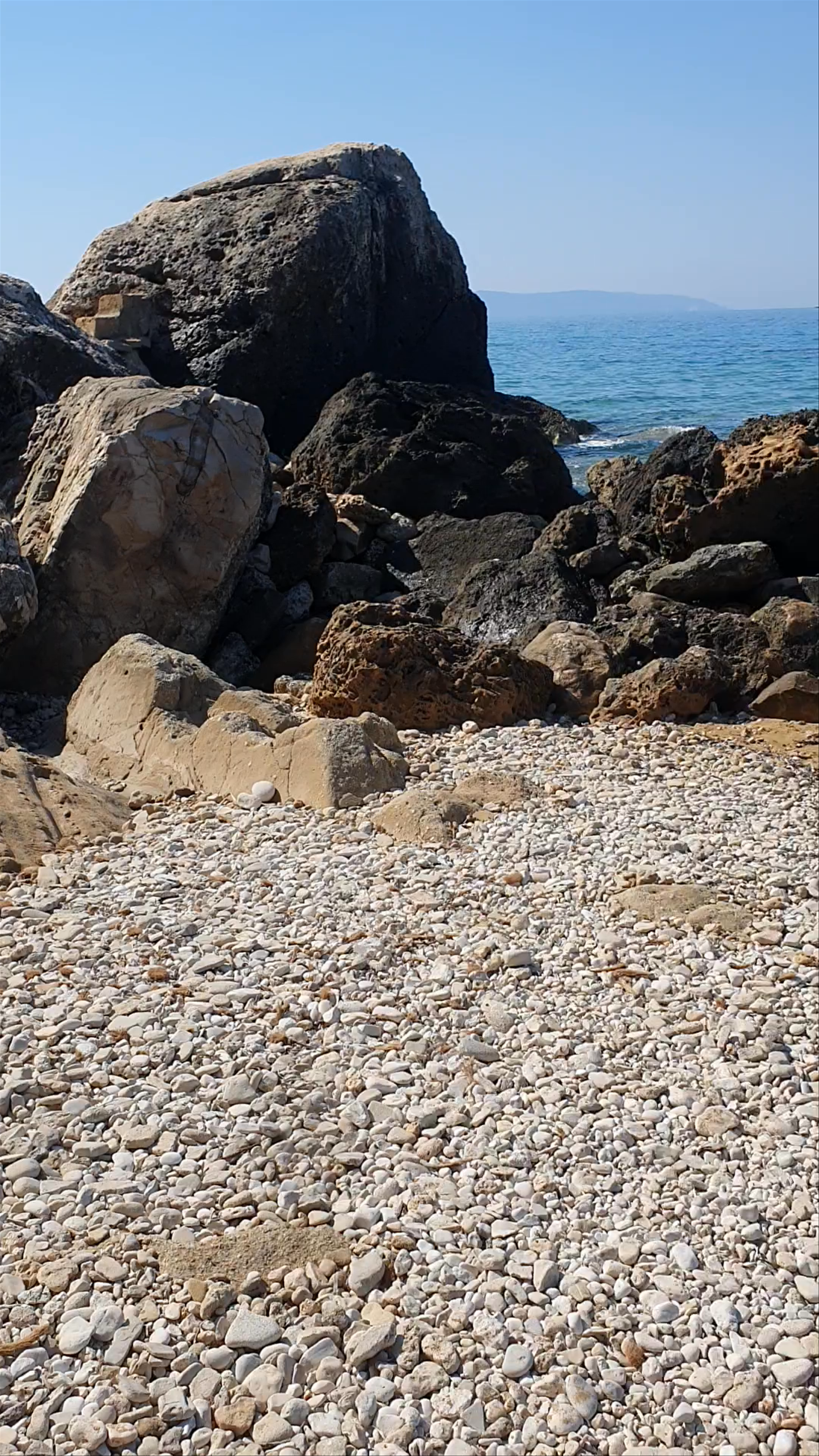 Paliolinos Beach: A Serene Rocky Seascape in Livathou, Greece