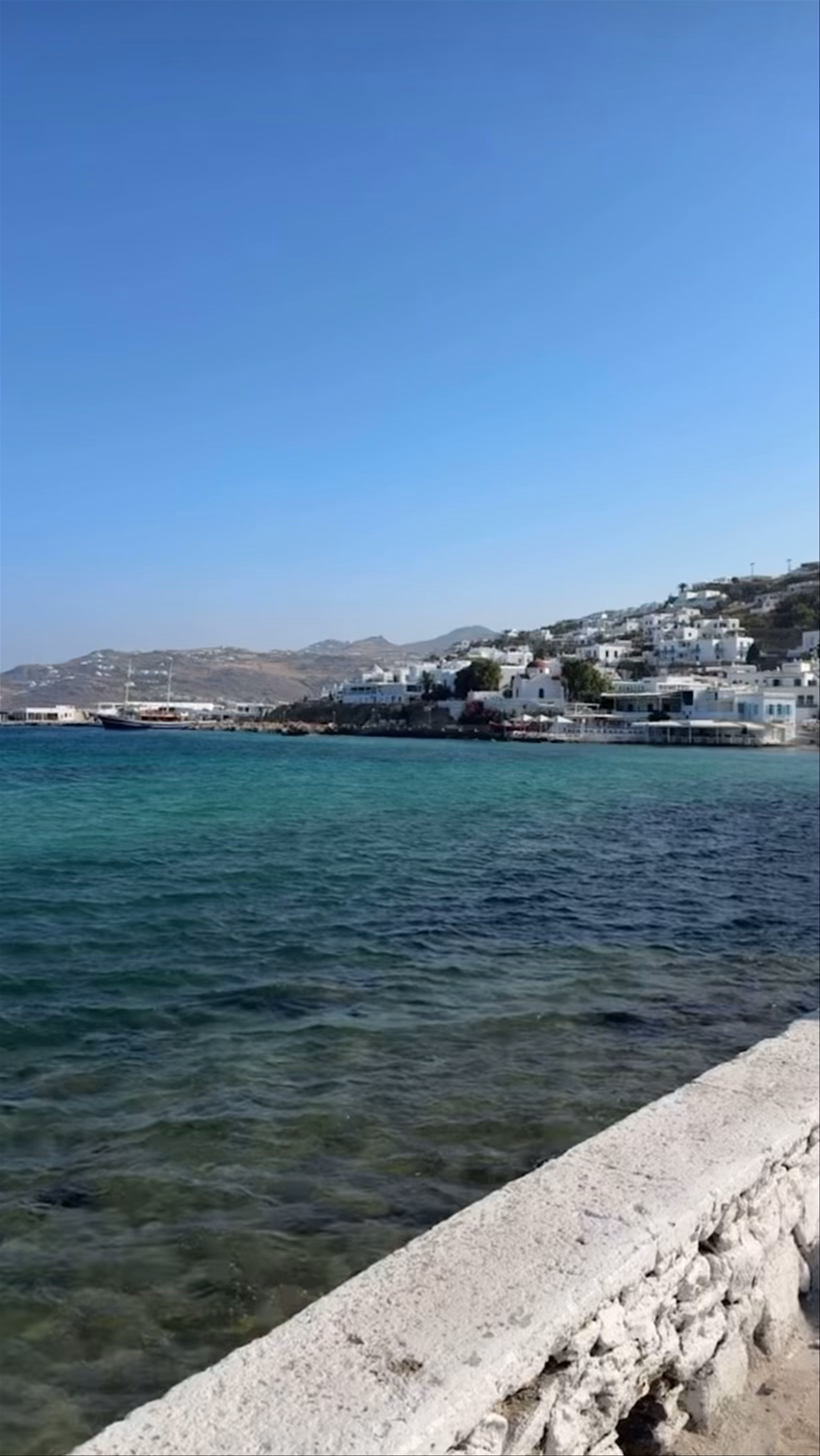 Sunny Stroll Along Mykonos Port in Tourlos, Greece