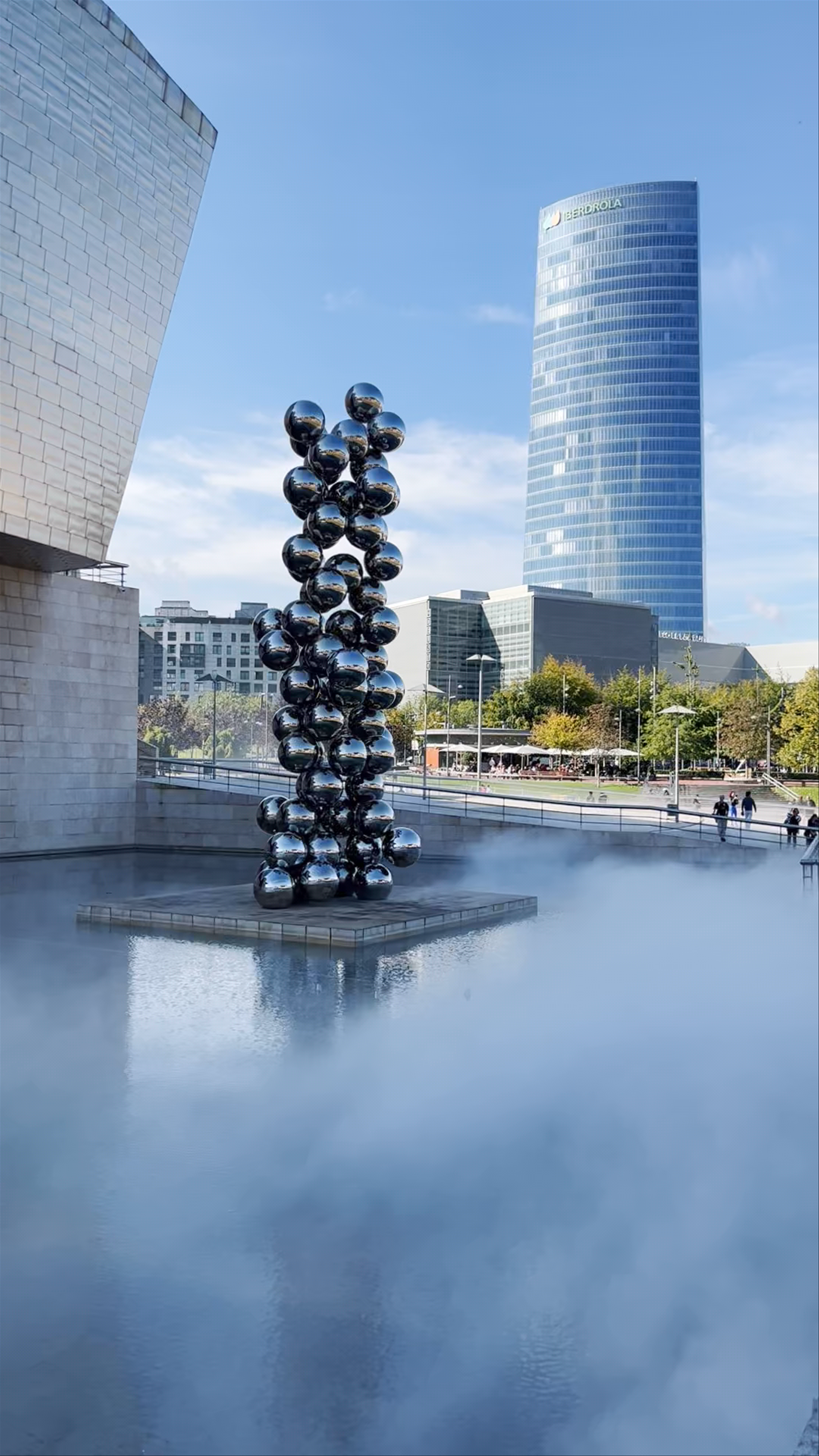 Tall Tree and The Eye Sculpture at Guggenheim Bilbao on a Misty Day