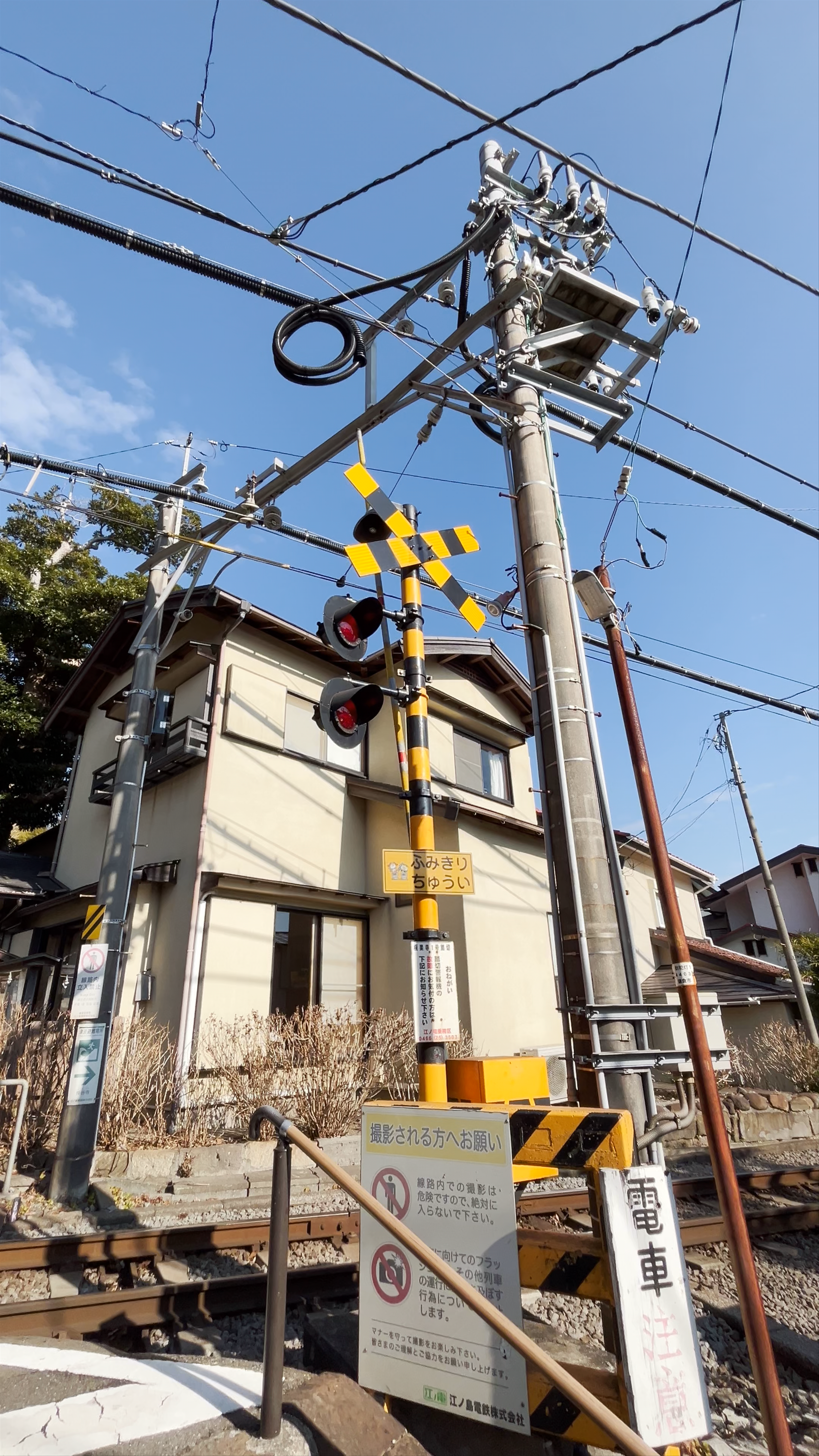 Goryo Shrine: Serene Entrance and Rail Crossing in Kamakura, Japan