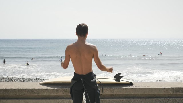 Doing a warm-up before surfing