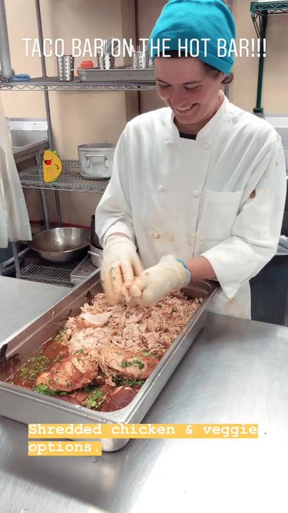 Wheatsfield Cooperative - Deli staff preparing shredded chicken for the hot bar! Deli foods made in house & from-scratch. - Grocery Near Me - Ames, Iowa